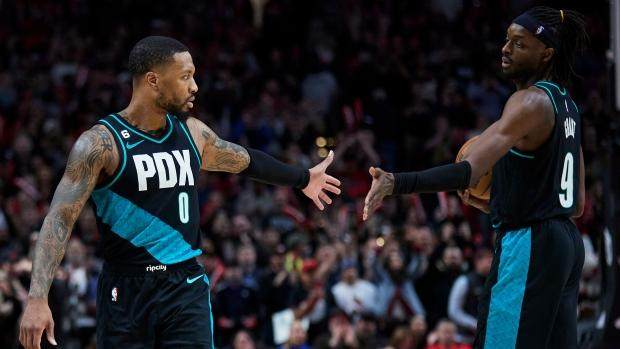 1668597995919040574.jpg jerami-grant-and-damian-lillard.jpg